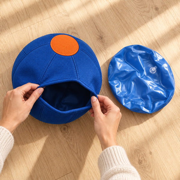 Placing the inner ball inside its fabric cover